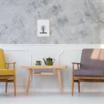 marble gray printed backdrop behind two lounge chairs and corner table